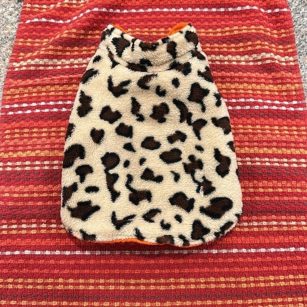 Small orange dog vest pockets are for decoration only.